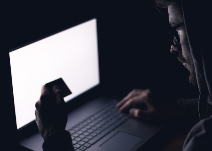 Hacker stealing money from different credit cards