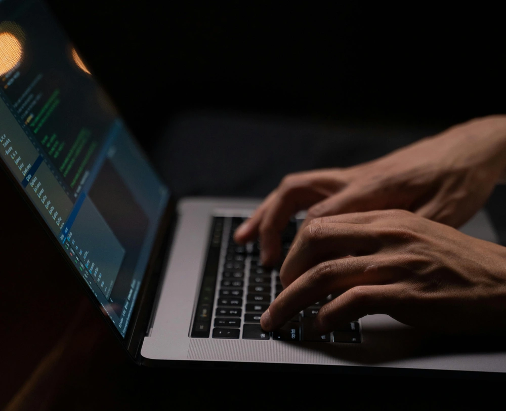 Man typing on a laptop